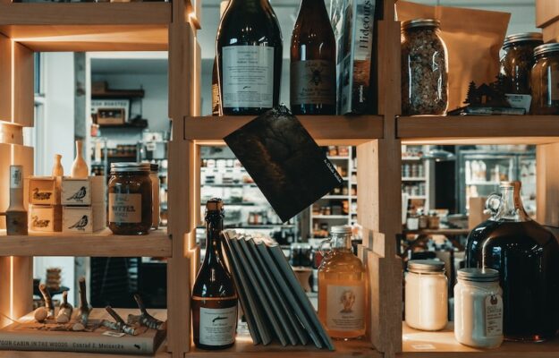 a shelf filled with lots of bottles of wine
